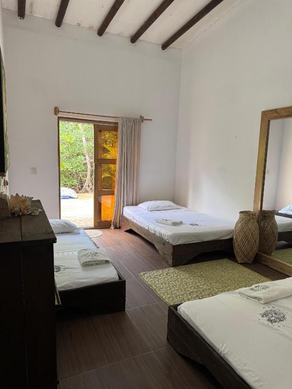 Postel nebo postele na pokoji v ubytování Medusa Hostel Isla Tintipan