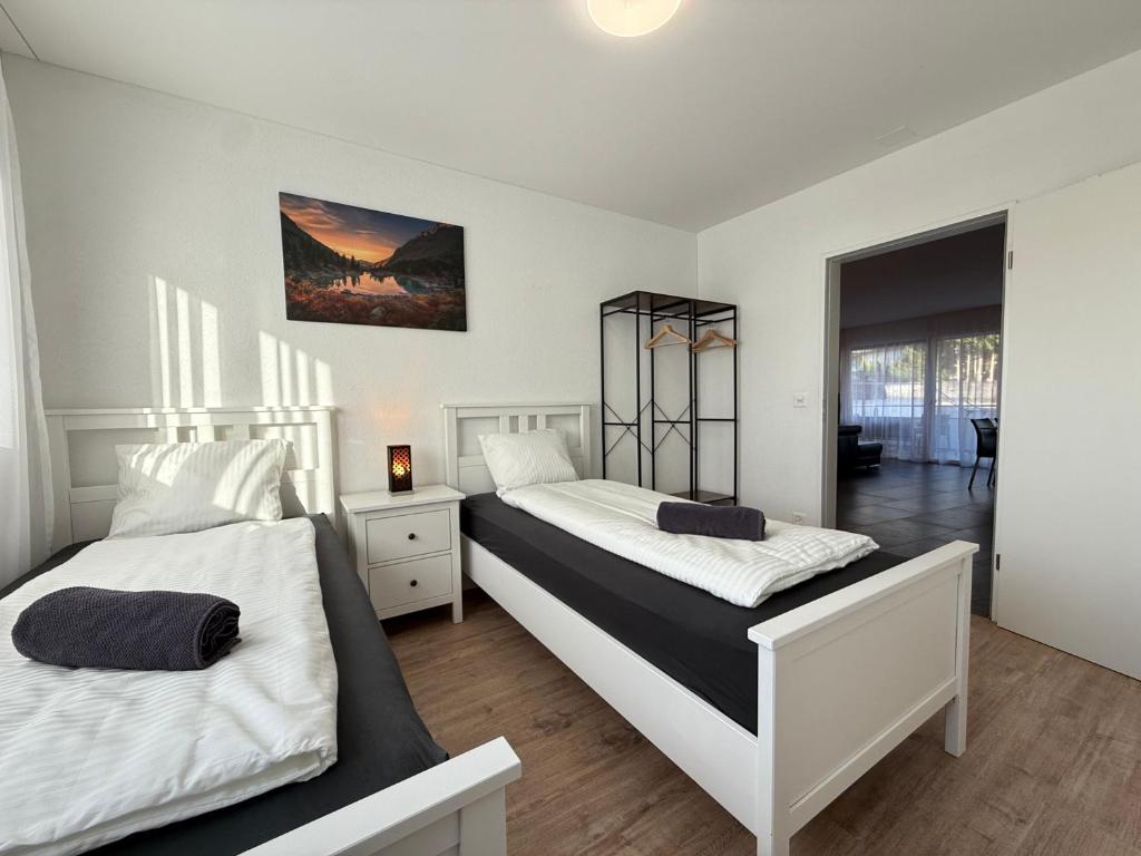 Postel nebo postele na pokoji v ubytování Swiss Suites
