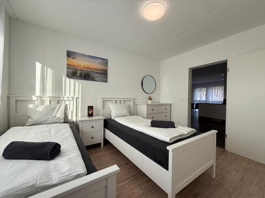 Postel nebo postele na pokoji v ubytování Swiss Suites
