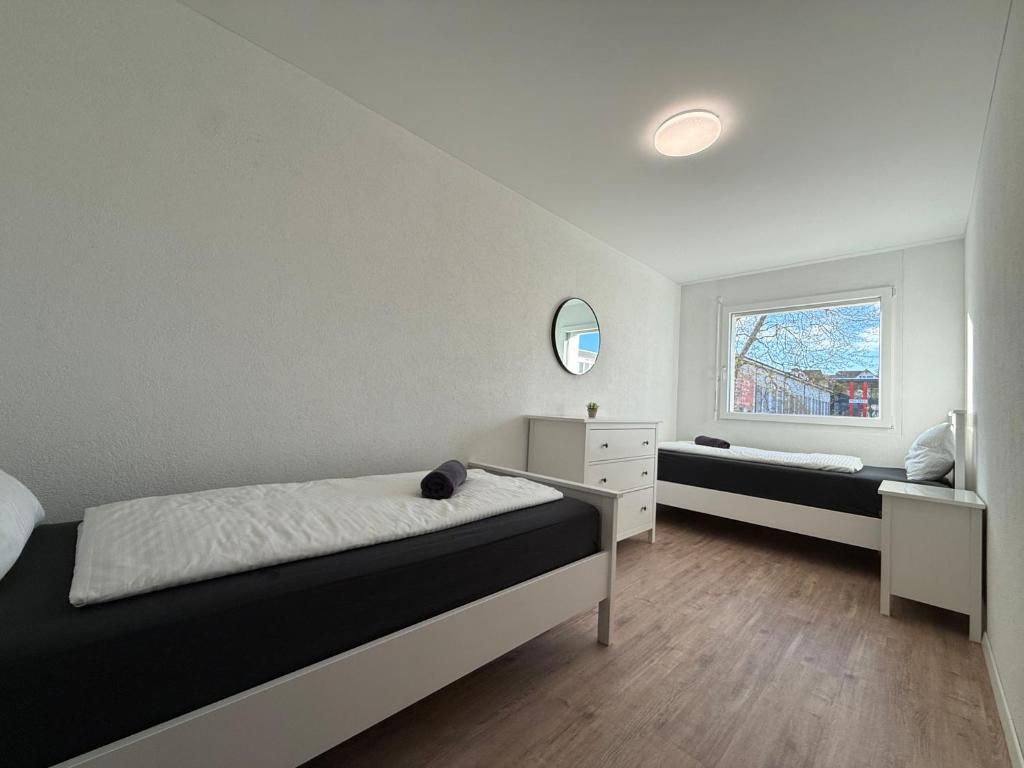 Postel nebo postele na pokoji v ubytování Swiss Suites