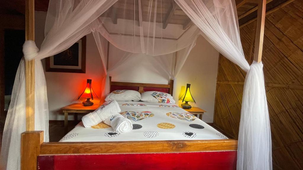 Postel nebo postele na pokoji v ubytování Hostal Olmito Canoa