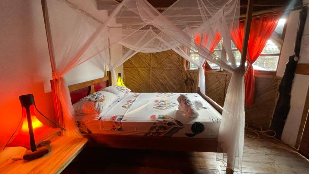 Postel nebo postele na pokoji v ubytování Hostal Olmito Canoa