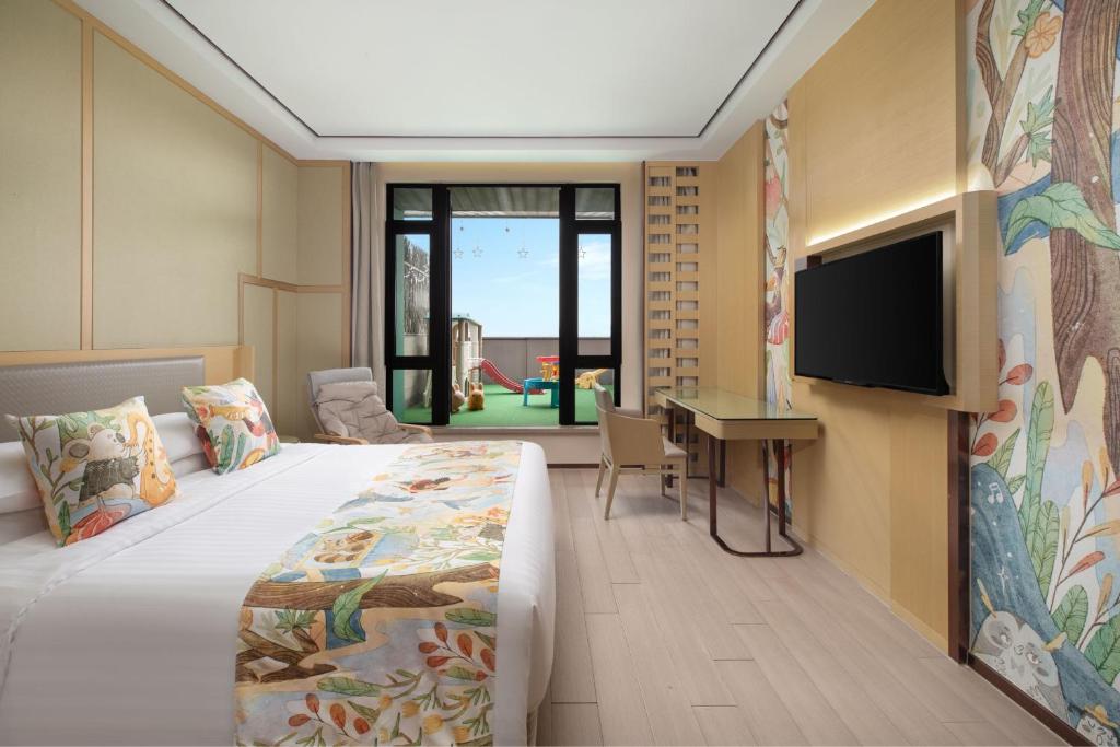Postel nebo postele na pokoji v ubytování Courtyard by Marriott Shanghai International Tourism and Resorts Zone