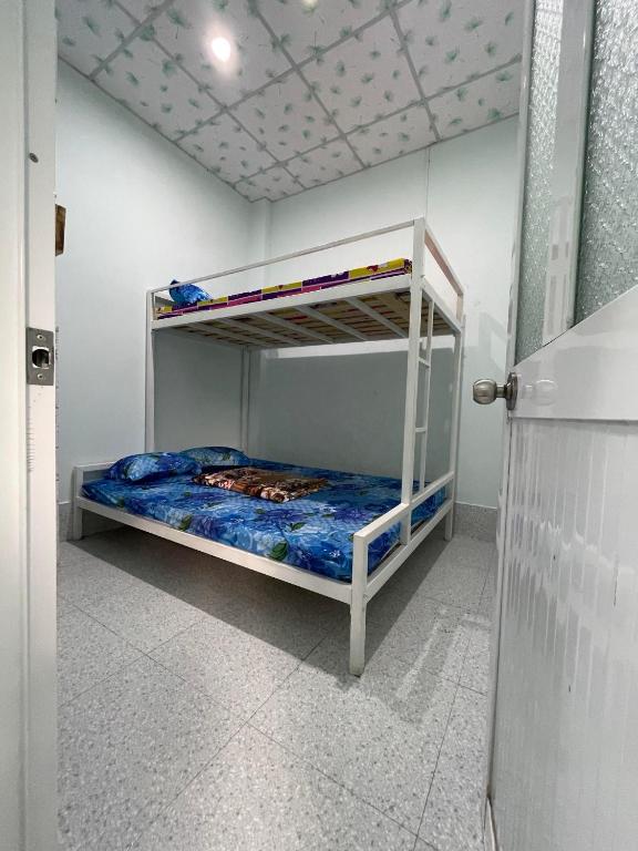 Postel nebo postele na pokoji v ubytování HOMESTAY Cát Tiên