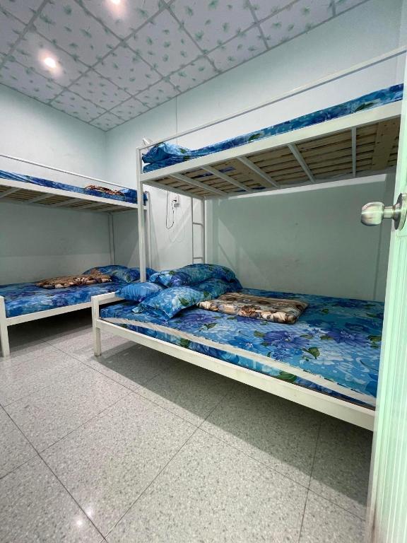 Postel nebo postele na pokoji v ubytování HOMESTAY Cát Tiên