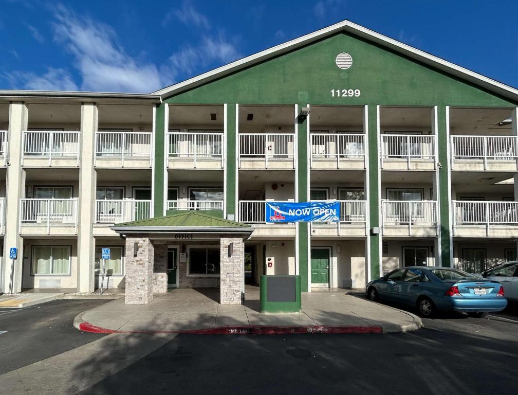 a large building with a parking lot in front of it at Studio 6 Rancho Cordova, CA in Rancho Cordova