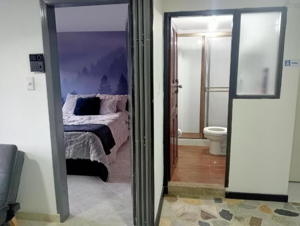 Postel nebo postele na pokoji v ubytování Hospedaje la Magia de Zipaquirá