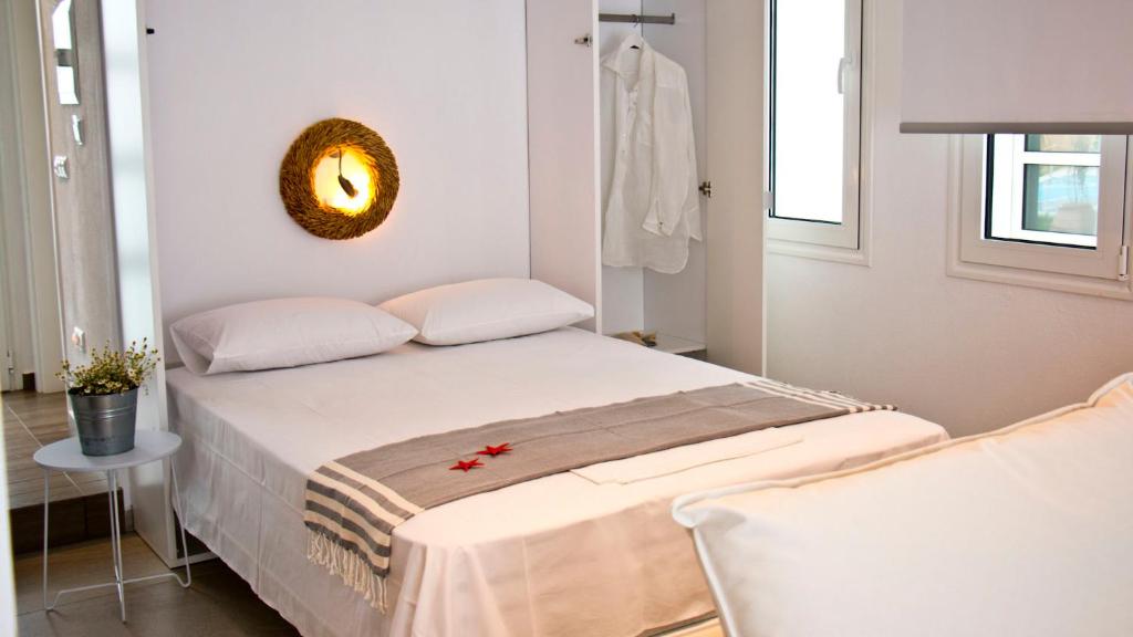 Postel nebo postele na pokoji v ubytování Aristotelia Gi Ikies - Olympiada Poolside Retreats