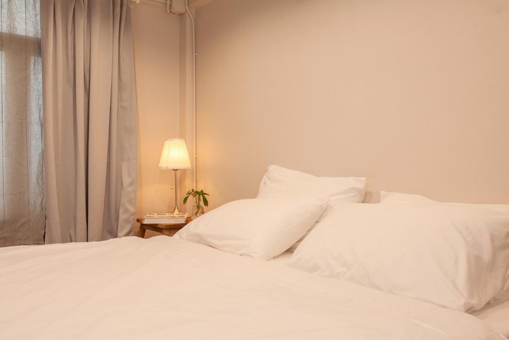 Postel nebo postele na pokoji v ubytování Mana Craft Stay
