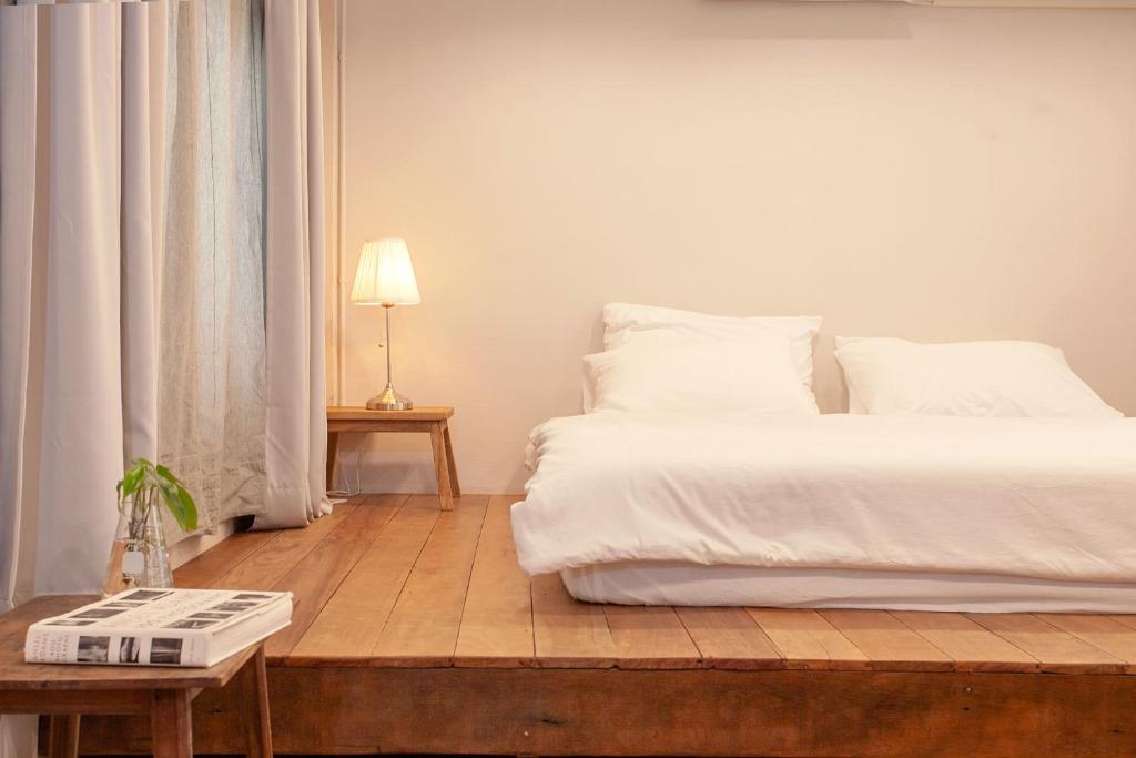 Postel nebo postele na pokoji v ubytování Mana Craft Stay