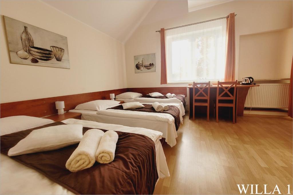 Postel nebo postele na pokoji v ubytování Willa Natalia