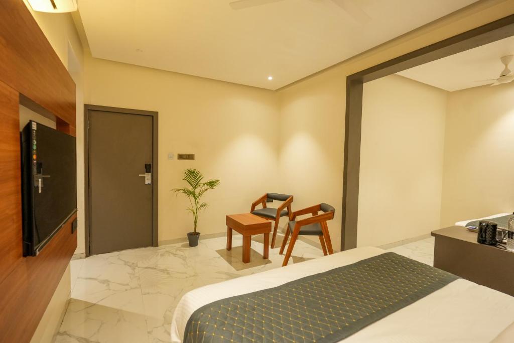 Postel nebo postele na pokoji v ubytování Hotel Sai Kamal