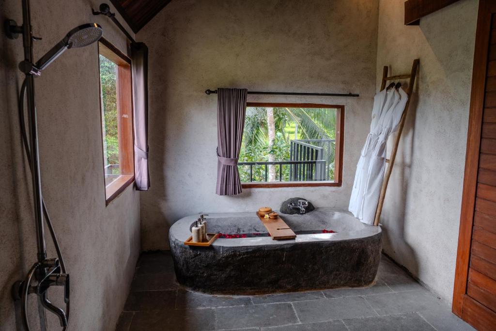 Postel nebo postele na pokoji v ubytování Hoshi Jungle Resort