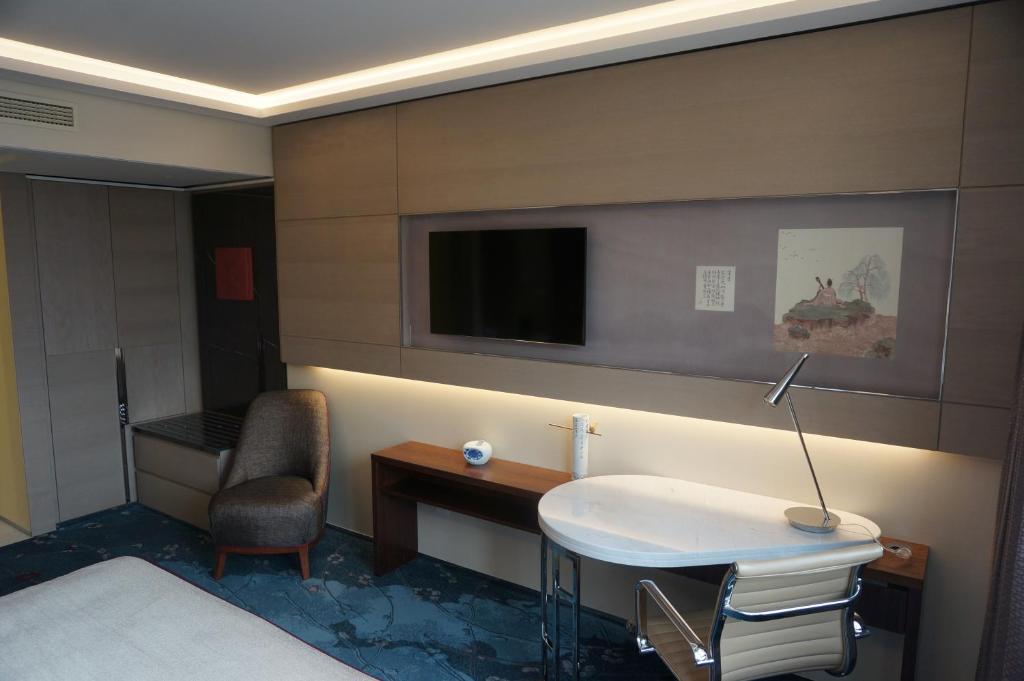 TV a/nebo společenská místnost v ubytování Tangla Hotel Brussels