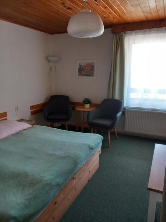 Postel nebo postele na pokoji v ubytování Penzion U Sochoru