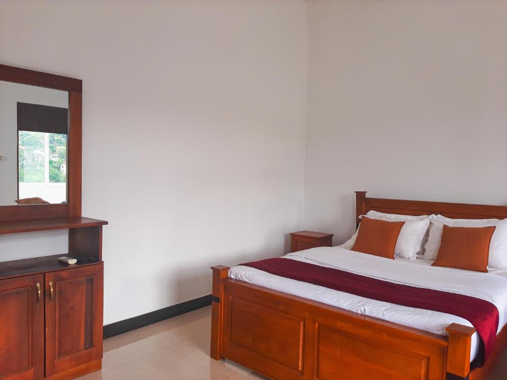 Postel nebo postele na pokoji v ubytování Terrace Kandy