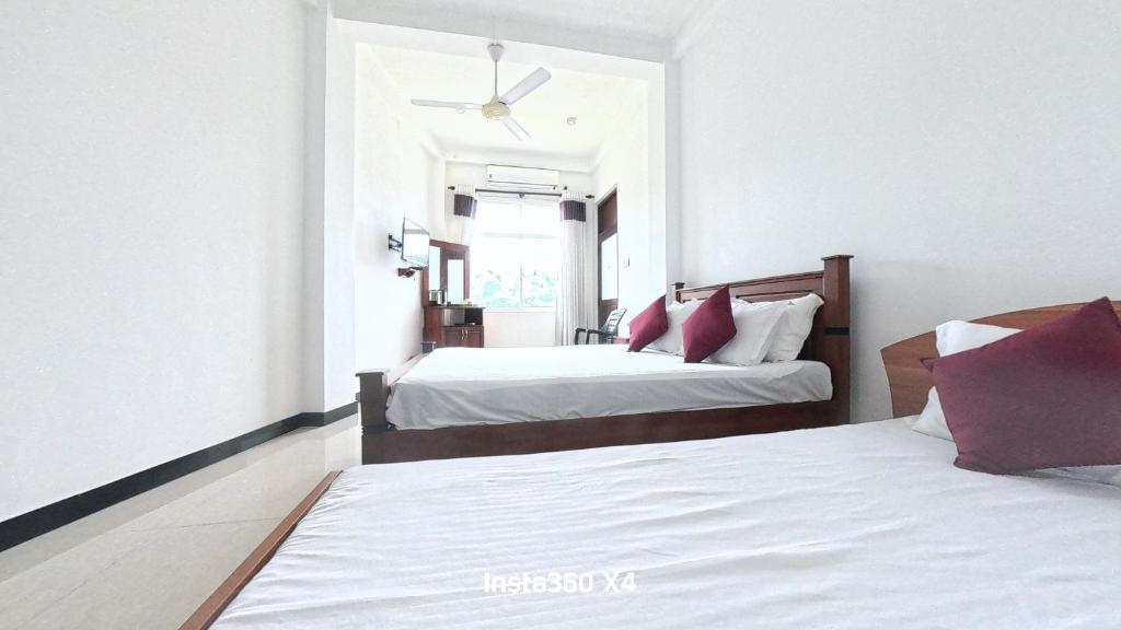Postel nebo postele na pokoji v ubytování Terrace Kandy