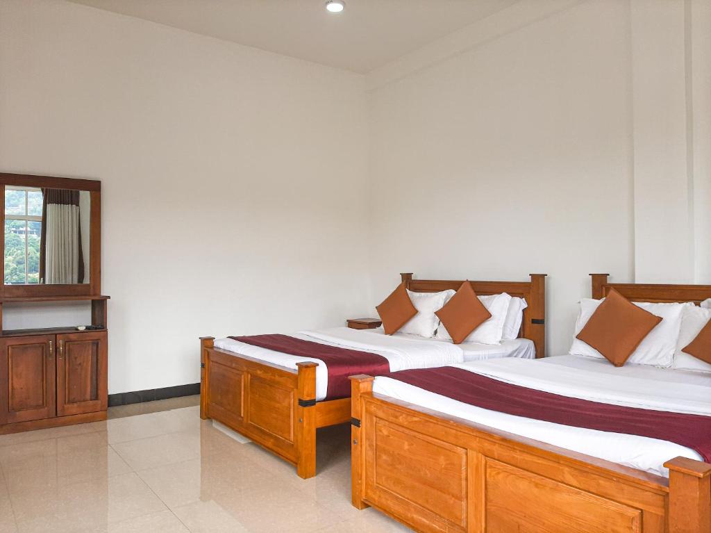 Postel nebo postele na pokoji v ubytování Terrace Kandy