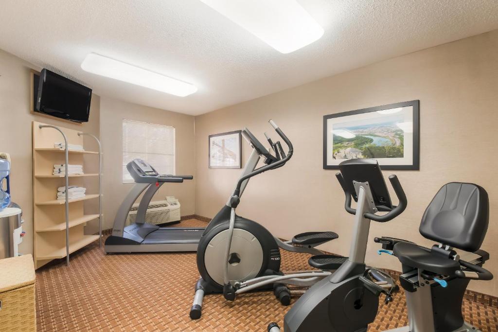 a gym with two exercise bikes and a treadmill at MainStay Suites Chattanooga Hamilton Place in Chattanooga
