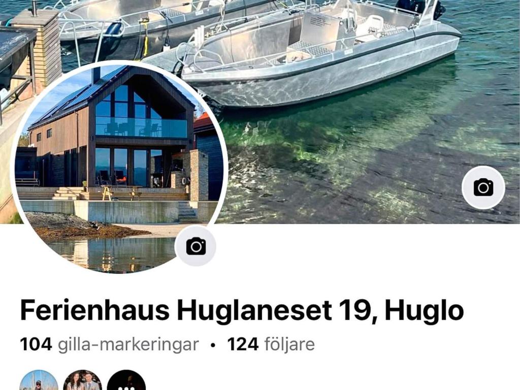 a boat is parked next to a house at 7 person holiday home in Huglo-By Traum in Nordhuglo
