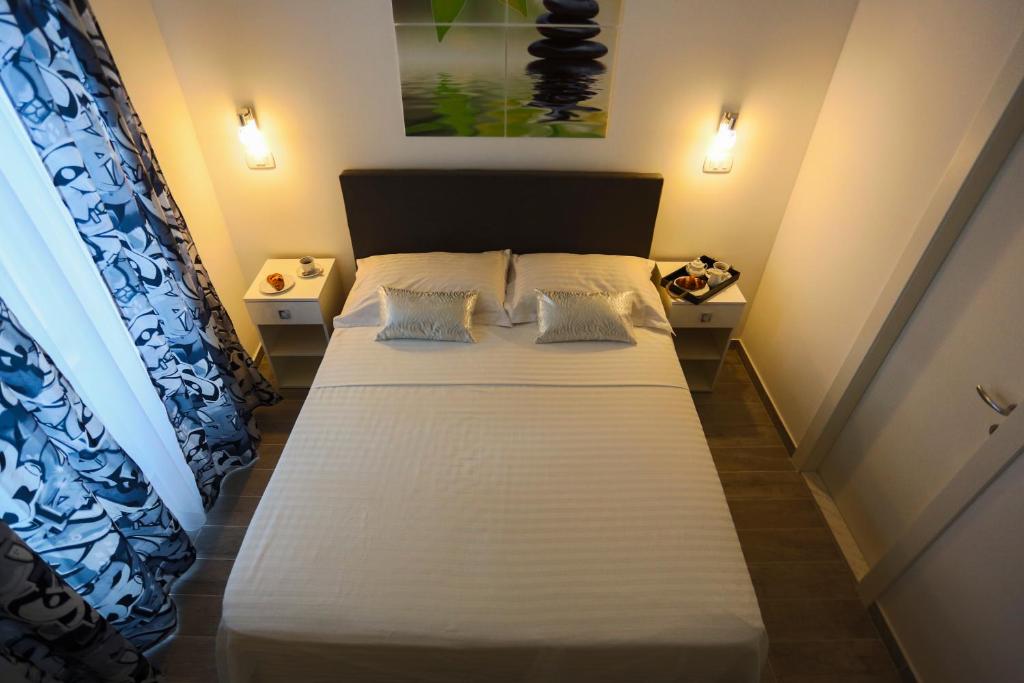 Postel nebo postele na pokoji v ubytování Nirvana rooms Split