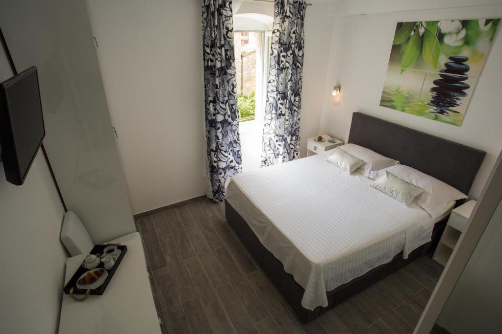 Postel nebo postele na pokoji v ubytování Nirvana rooms Split