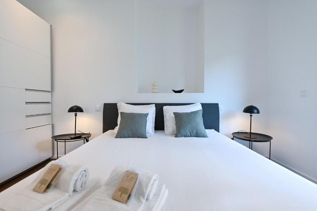 Giường trong phòng chung tại Lugano Suite modern concept 3