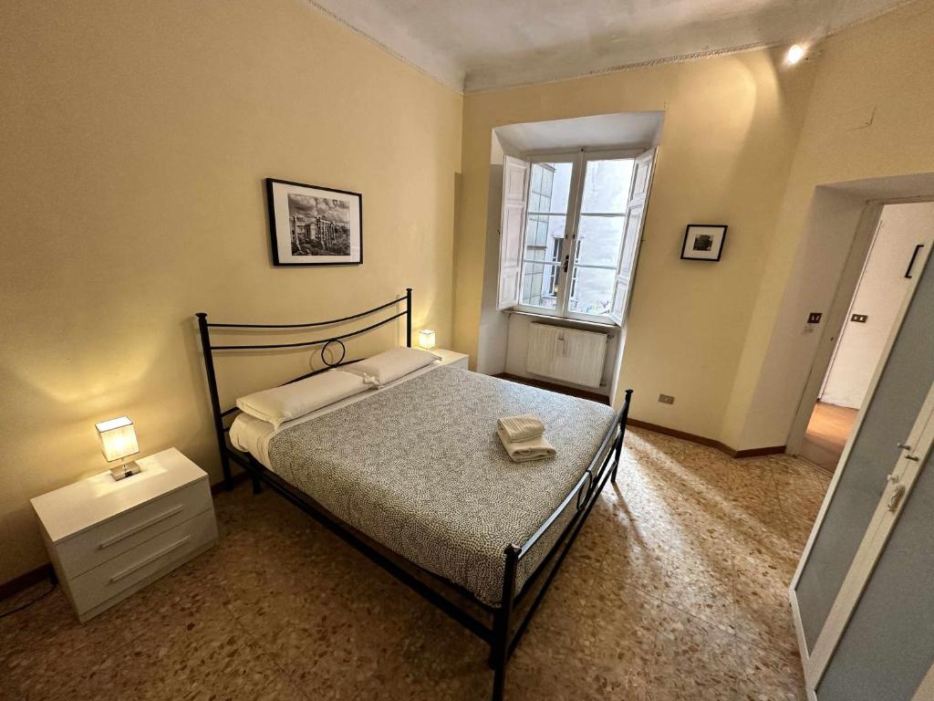 A bed or beds in a room at Rhome Holiday Mameli