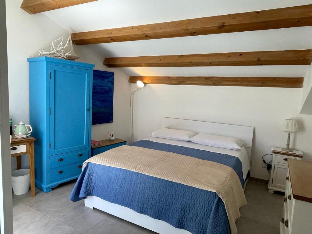 Postel nebo postele na pokoji v ubytování Terrazza alla Cala