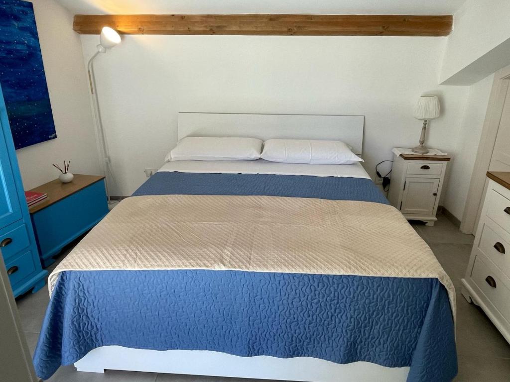 Postel nebo postele na pokoji v ubytování Terrazza alla Cala