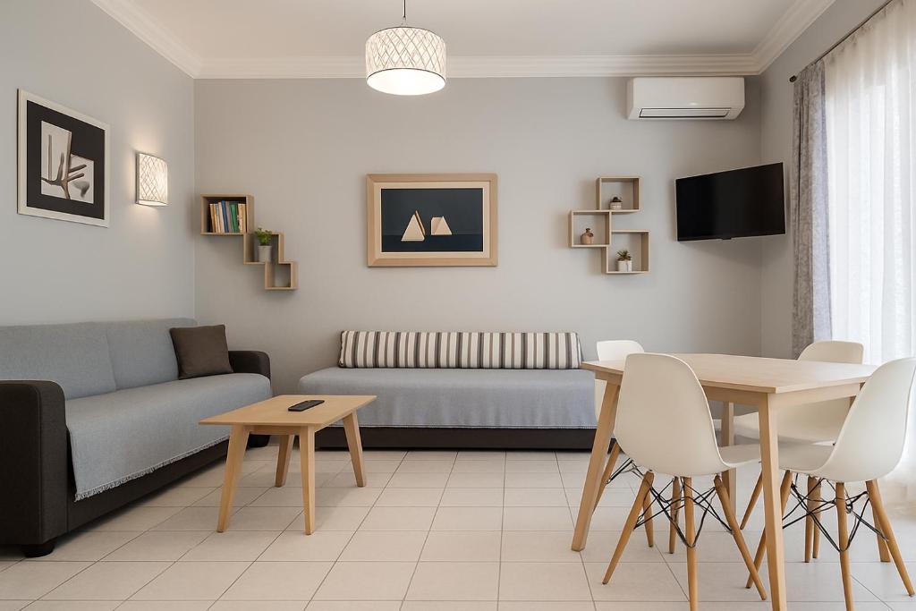 a living room with a couch and a table at Lion house Vrachati in Vrachati