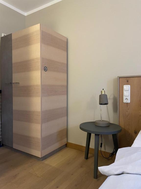 Postel nebo postele na pokoji v ubytování Hotel Stadthaus