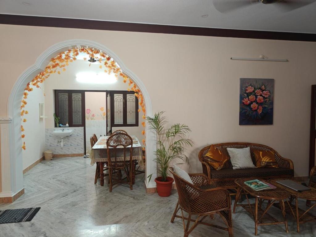 a living room with a couch and a table at Ashray Seaside in Jāmb
