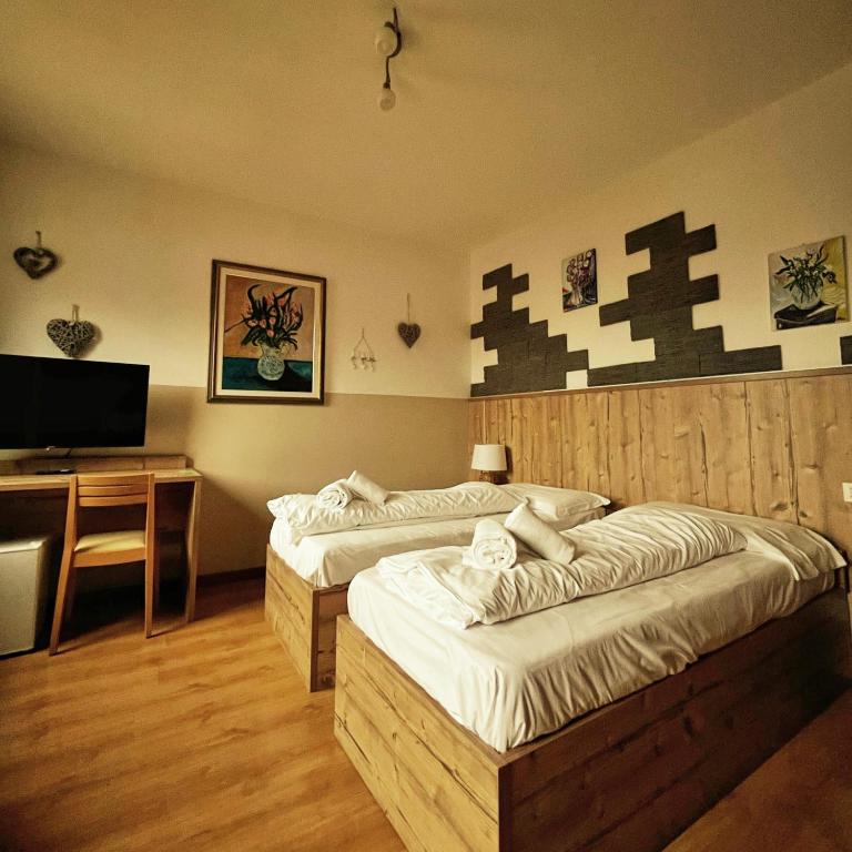Posteľ alebo postele v izbe v ubytovaní Hotel Tarvisio Four Seasons