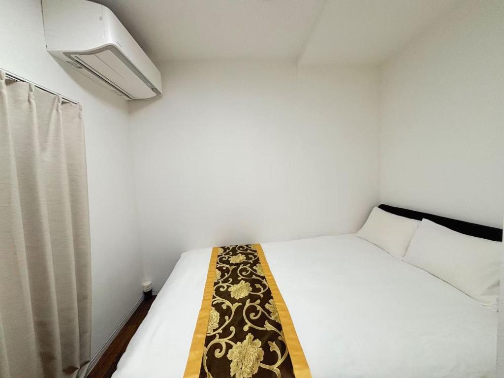 Ένα ή περισσότερα κρεβάτια σε δωμάτιο στο 花の郷田端b01