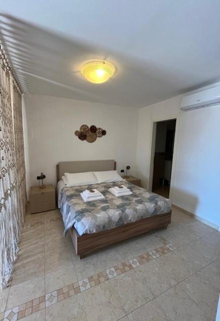 Postel nebo postele na pokoji v ubytování Gli Ulivi Di Montalbano