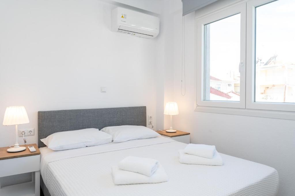 Postel nebo postele na pokoji v ubytování Anastasia Residential Complex