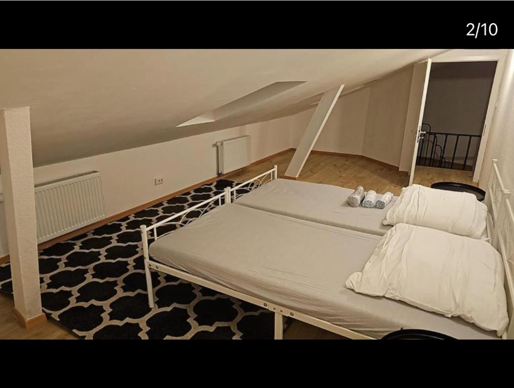 a large bed in a room with a attic at Rösrath Wohnung mit Küche in Rösrath