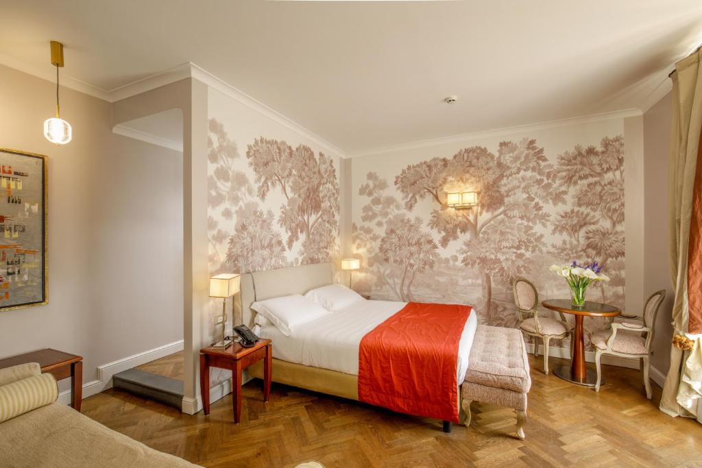 Łóżko lub łóżka w pokoju w obiekcie Vivaldi Luxury Rooms