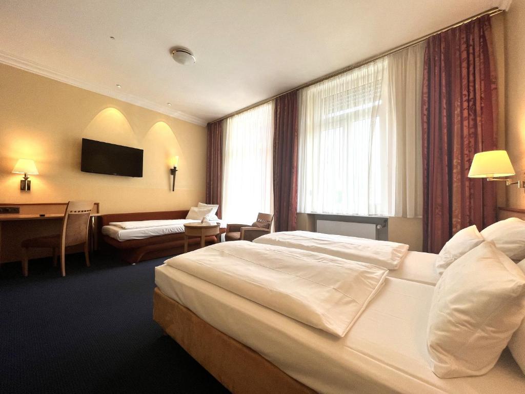 Postel nebo postele na pokoji v ubytování Hotel Mack Private Inn
