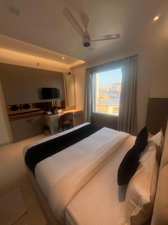Postel nebo postele na pokoji v ubytování Hotel Glorious Grand