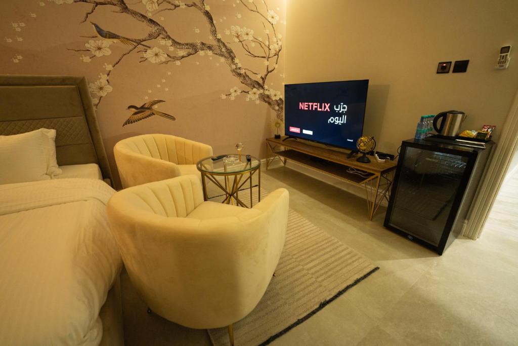 TV a/nebo společenská místnost v ubytování شقق دخـول ذاتي حي الملقا الرياض