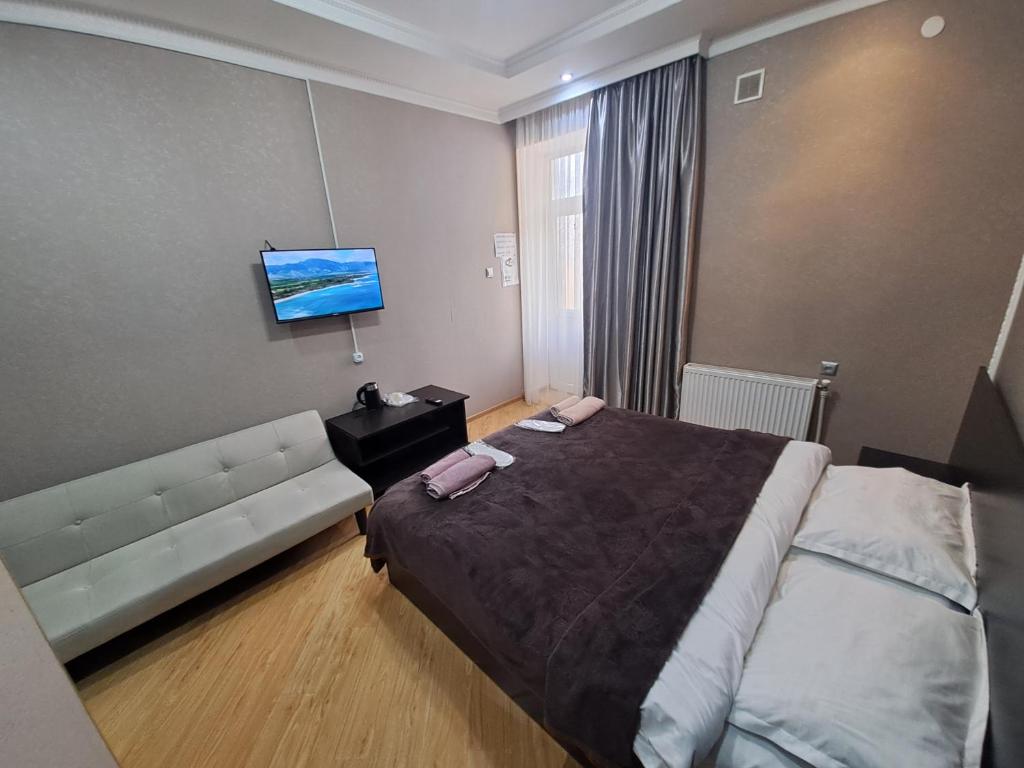 Llit o llits en una habitació de Guest House "AKHALTSIKHE"