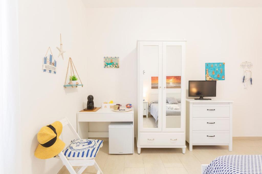 Tempat tidur dalam kamar di Il Poggetto di Porto Ercole Affittacamere
