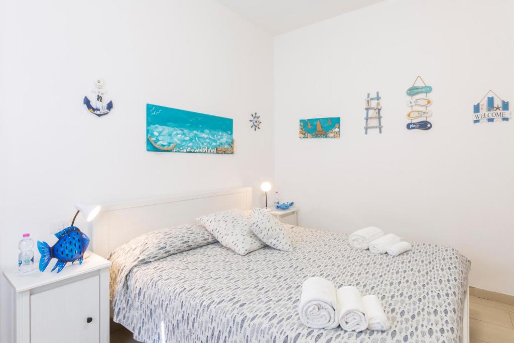 Tempat tidur dalam kamar di Il Poggetto di Porto Ercole Affittacamere