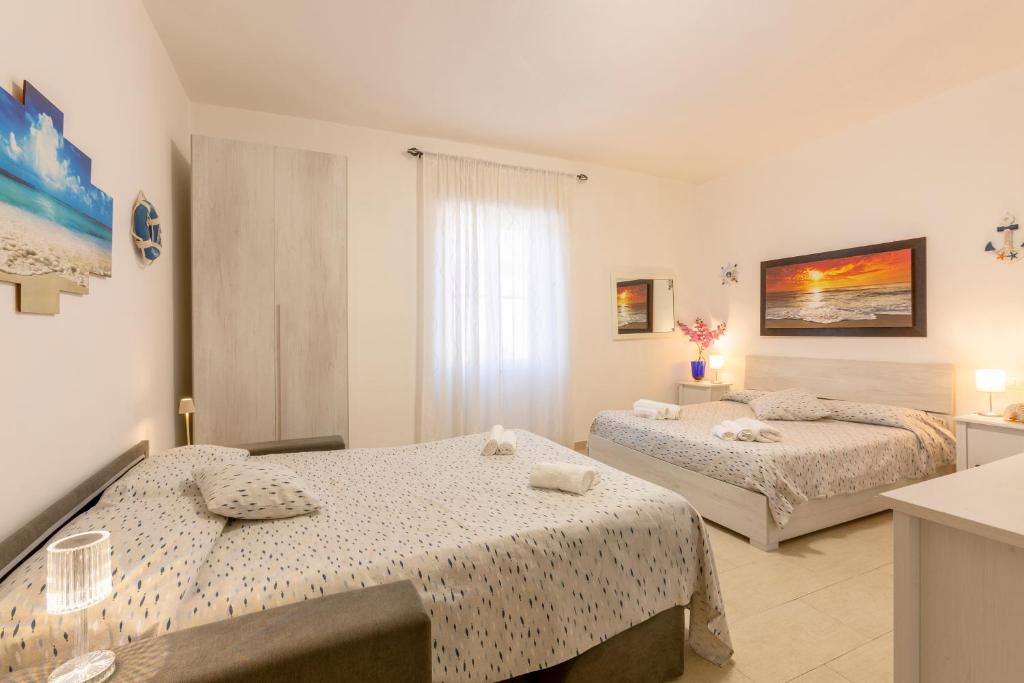 Tempat tidur dalam kamar di Il Poggetto di Porto Ercole Affittacamere