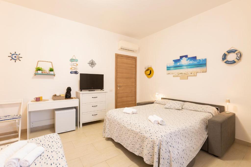 Tempat tidur dalam kamar di Il Poggetto di Porto Ercole Affittacamere