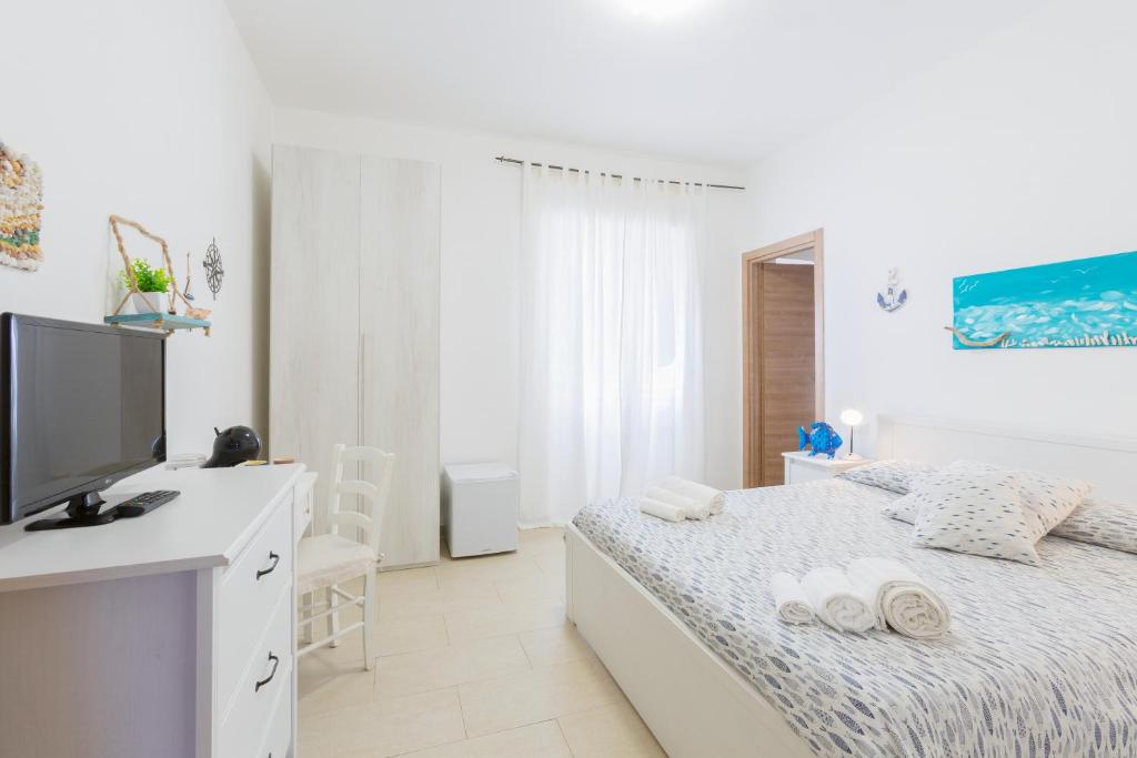 Tempat tidur dalam kamar di Il Poggetto di Porto Ercole Affittacamere