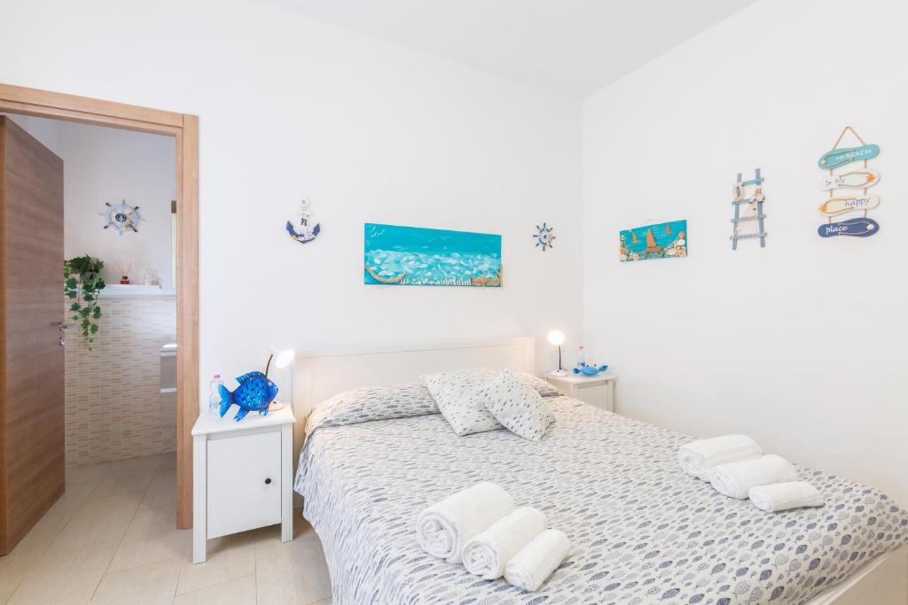 Tempat tidur dalam kamar di Il Poggetto di Porto Ercole Affittacamere