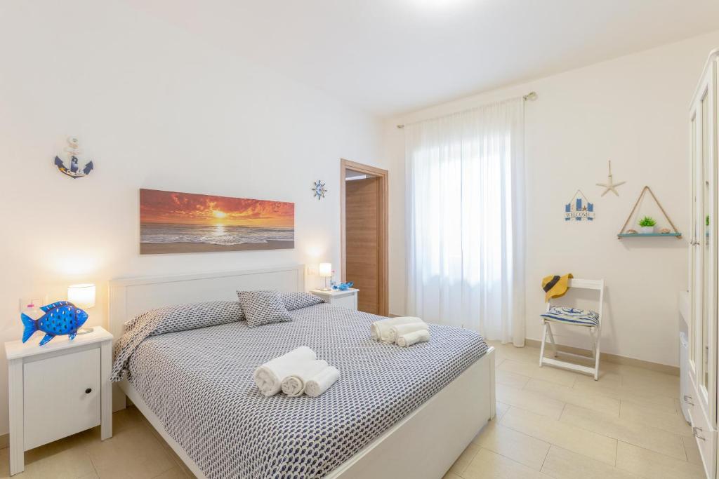 Tempat tidur dalam kamar di Il Poggetto di Porto Ercole Affittacamere